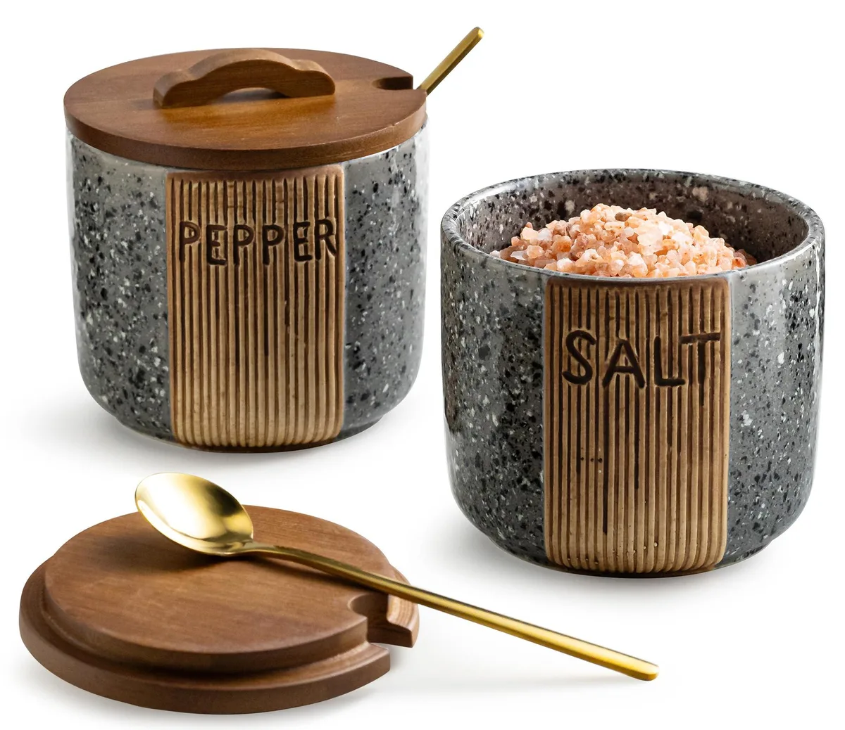 Two gray ceramic salt cellars with wooden lids and metal spoons