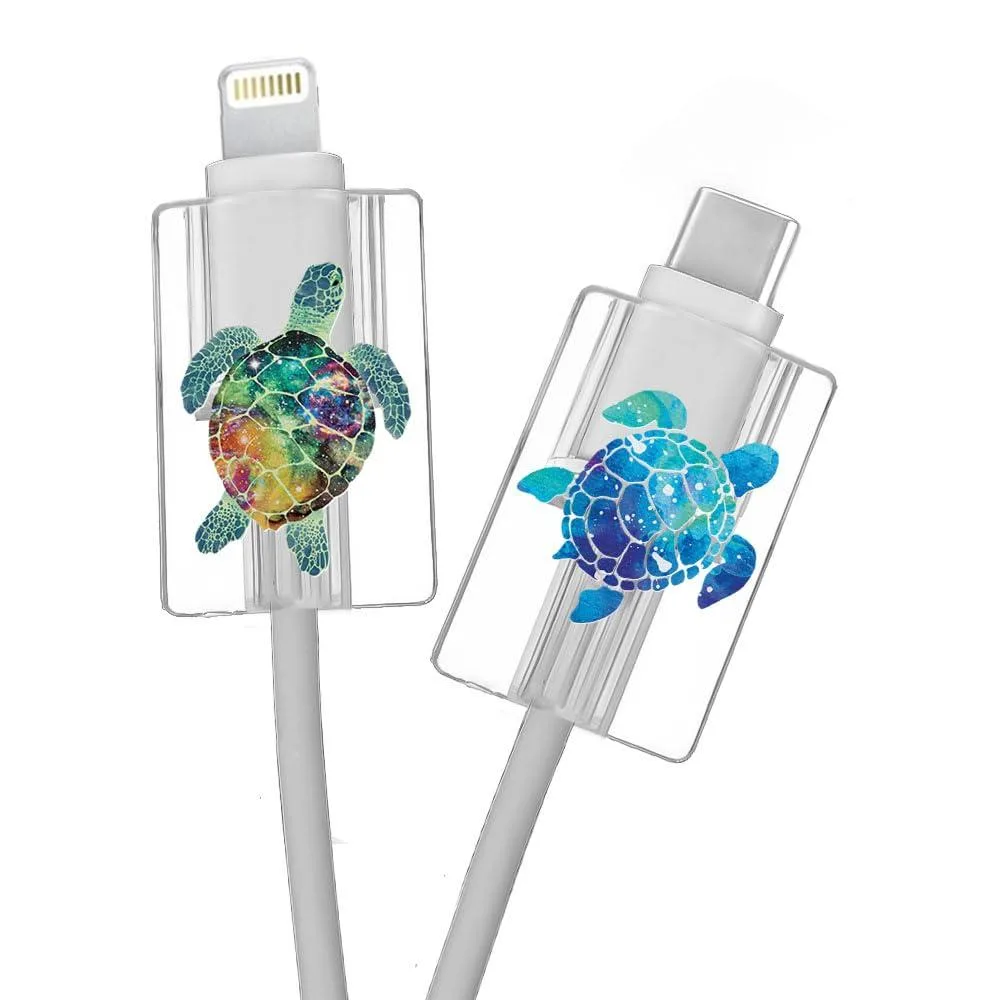 Two small rectangular cable protectors, black PVC with sea turtle prints, self-adhesive backing, 1.1 by .7 inches each