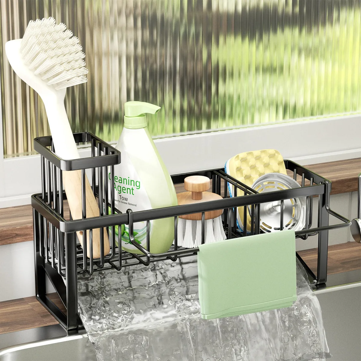 Black 304 stainless steel sink caddy with divided compartments, brush holder, removable towel bar and sloped drain tray