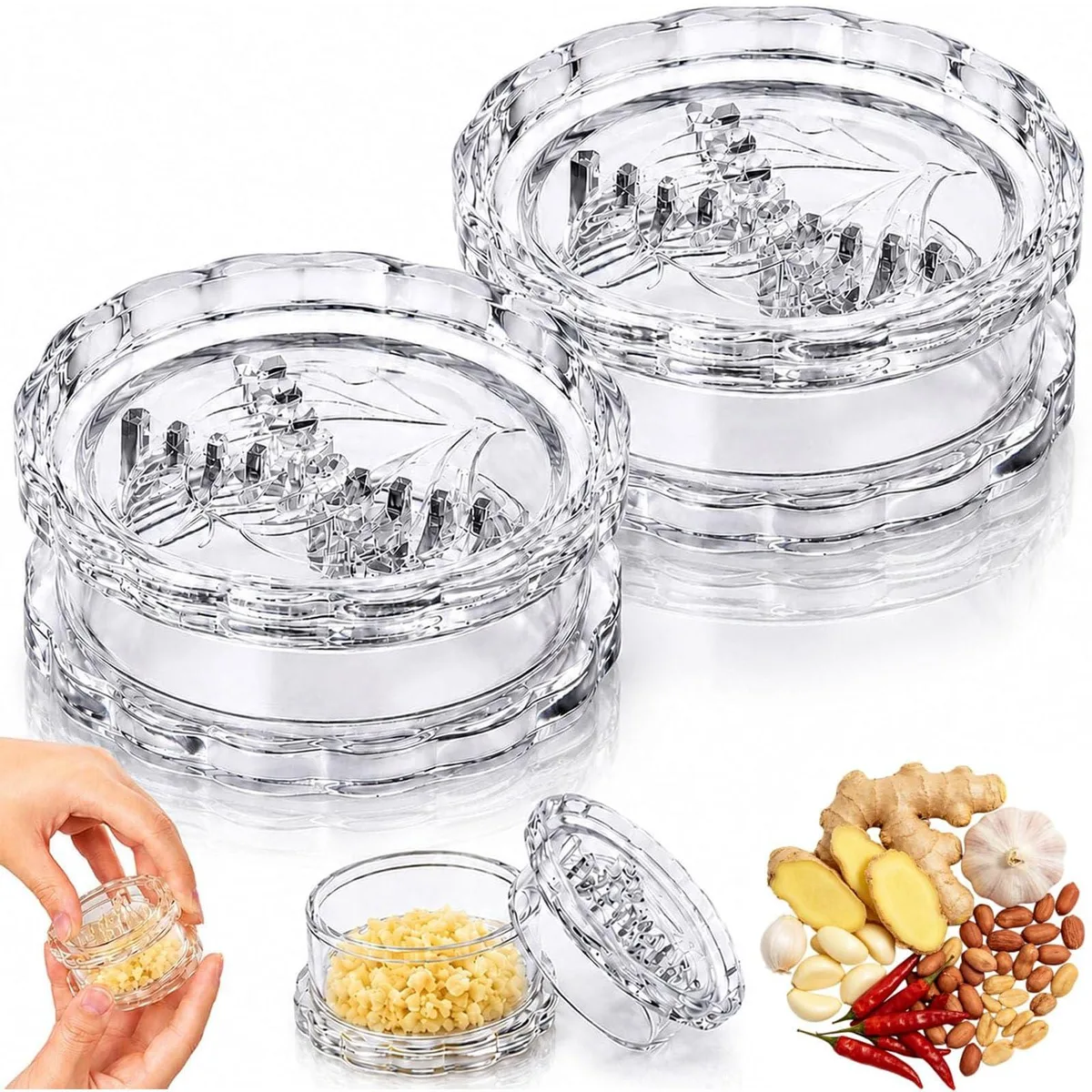 Two white plastic garlic twister mincers, cylindrical with clear bodies and interlocking teeth