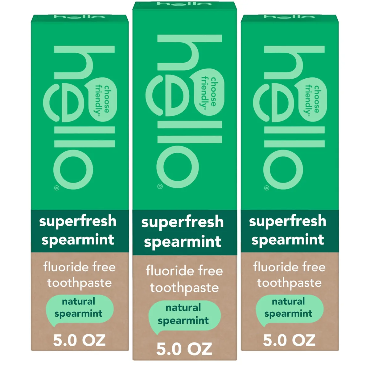 Three white 5.0 oz toothpaste tubes with green caps in a row