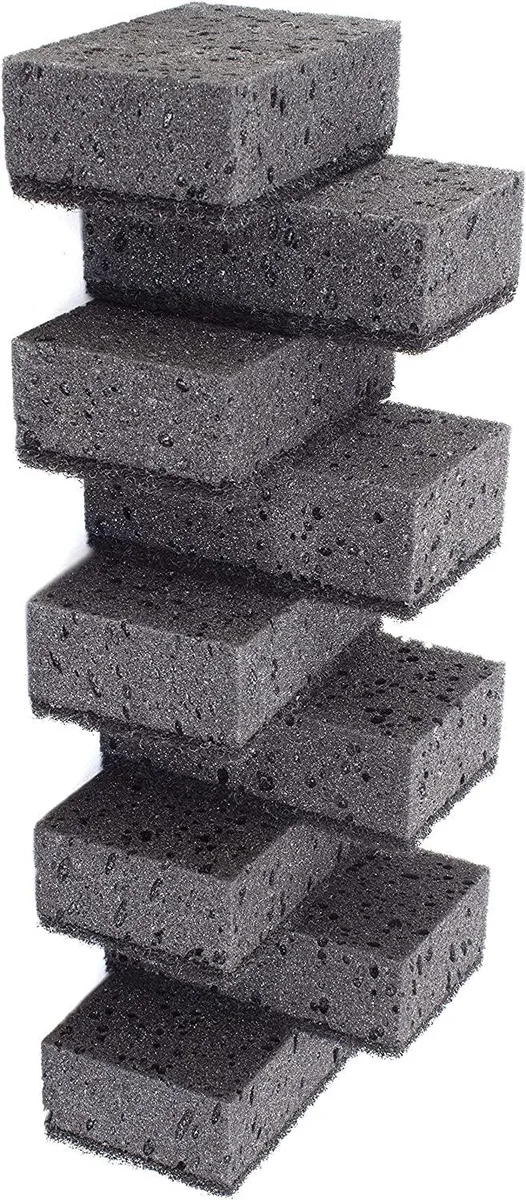 White rectangular scrub sponges in a nine pack each measuring 4.3 by 2.8 by 1.4 inches
