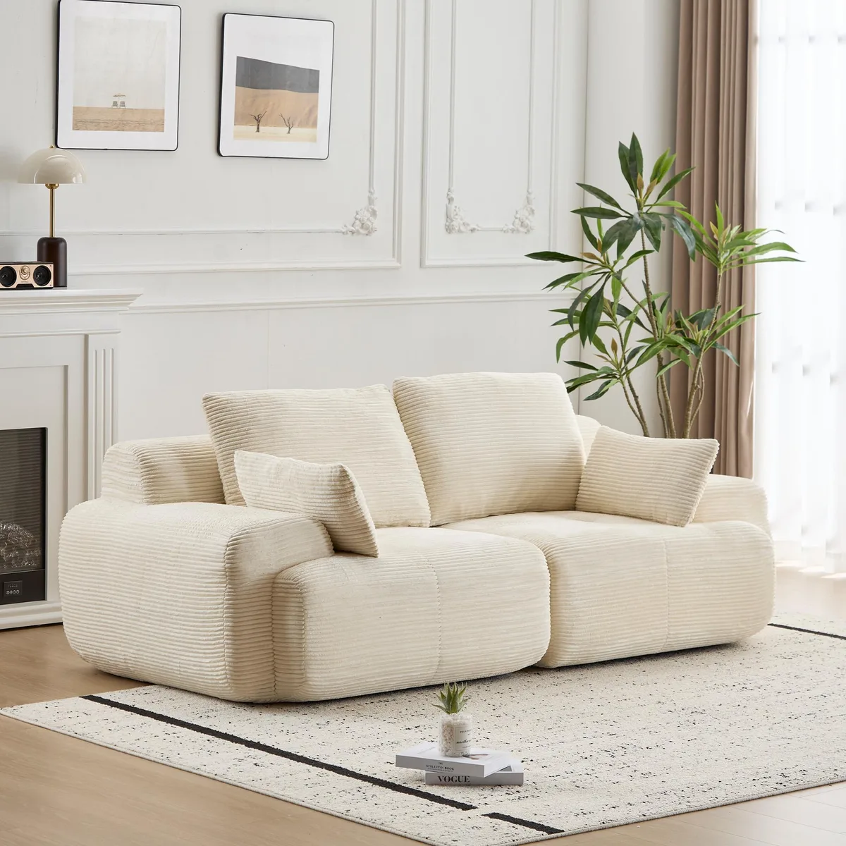 Beige corduroy two-seater sectional sofa, low-profile modular form with deep seat and scatter cushions