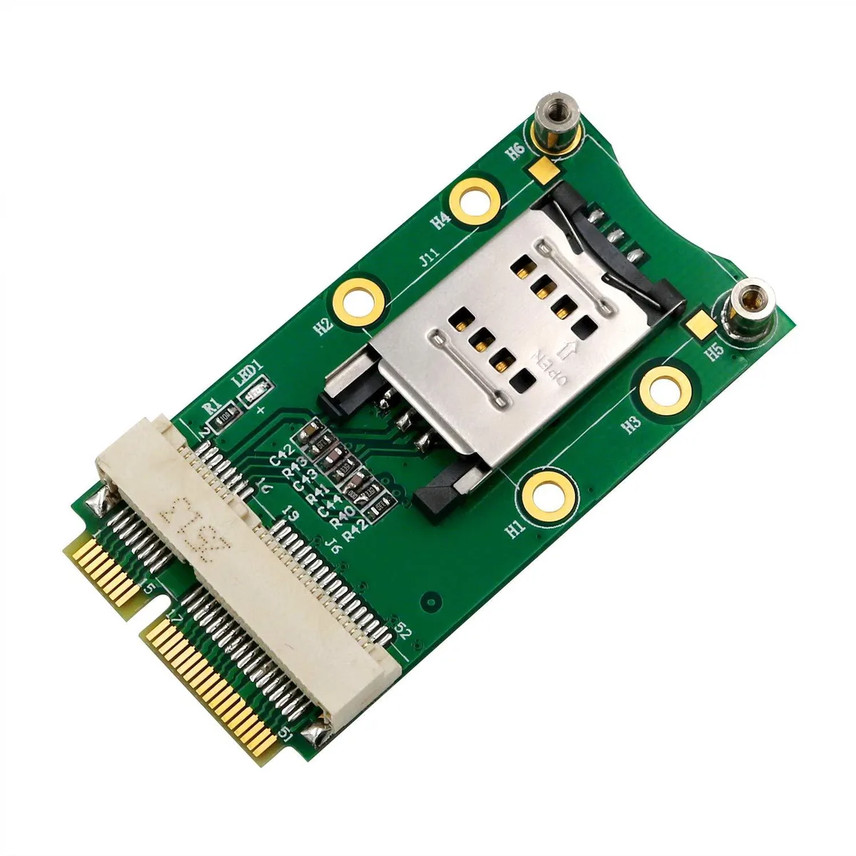 Small green rectangular circuit board with gold edge connector and hinged SIM card holder on top