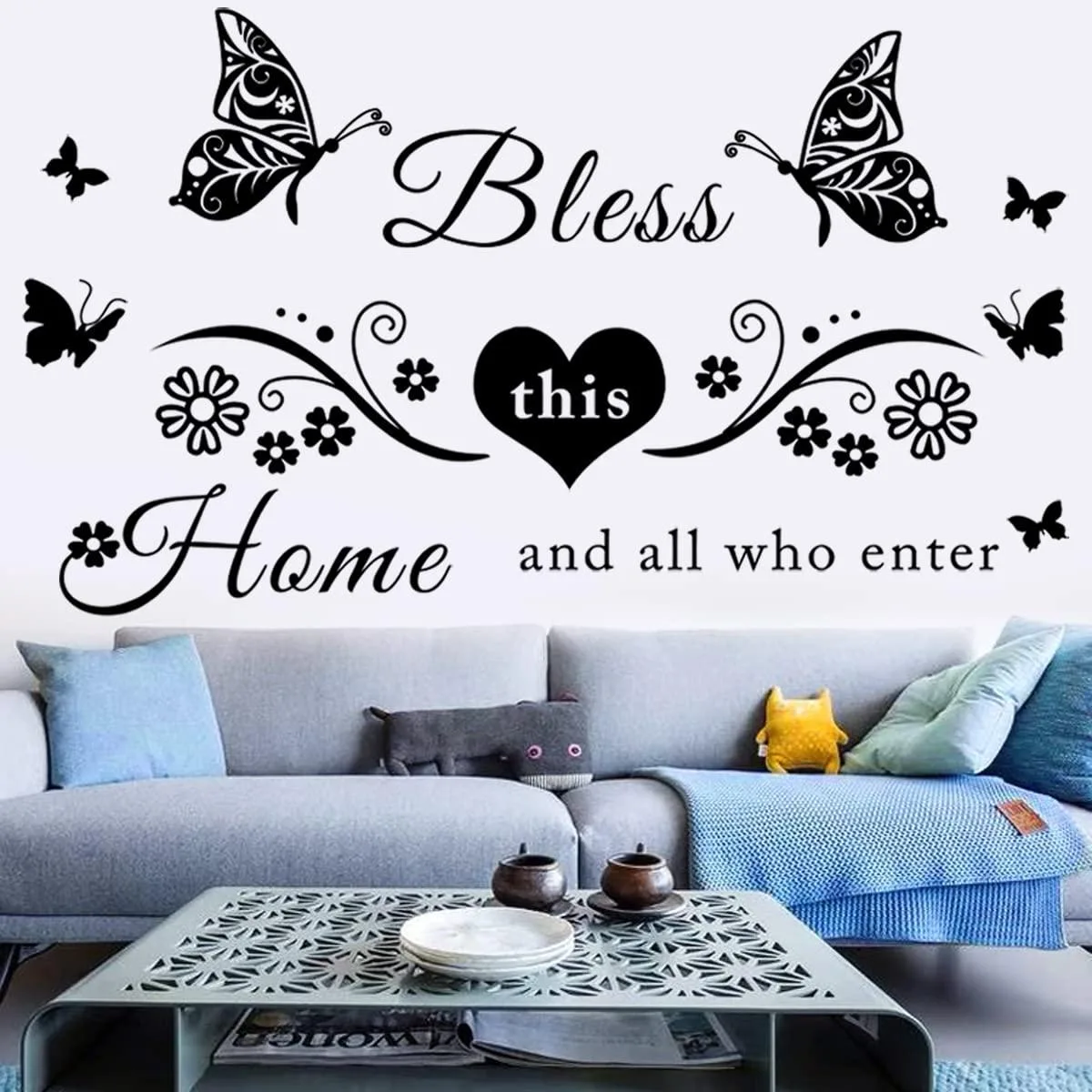 Black vinyl wall decal sheet with "Bless This Home" text, flowers and butterflies, 35.5 by 11.8 inches unassembled