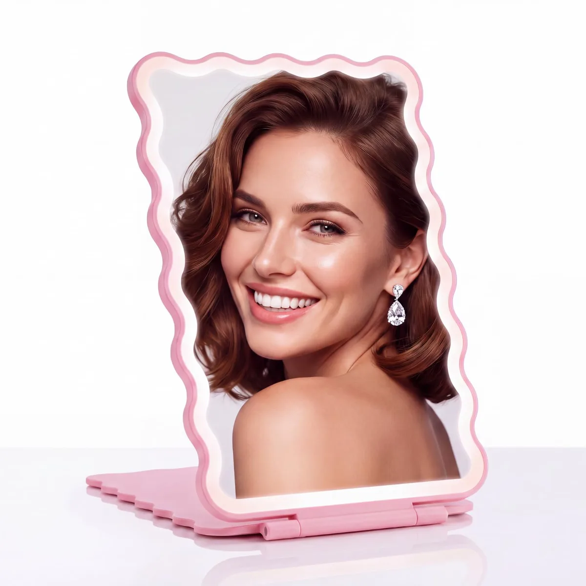 Rose pink wavy plastic mirror folded flat, 60 LEDs visible on frame