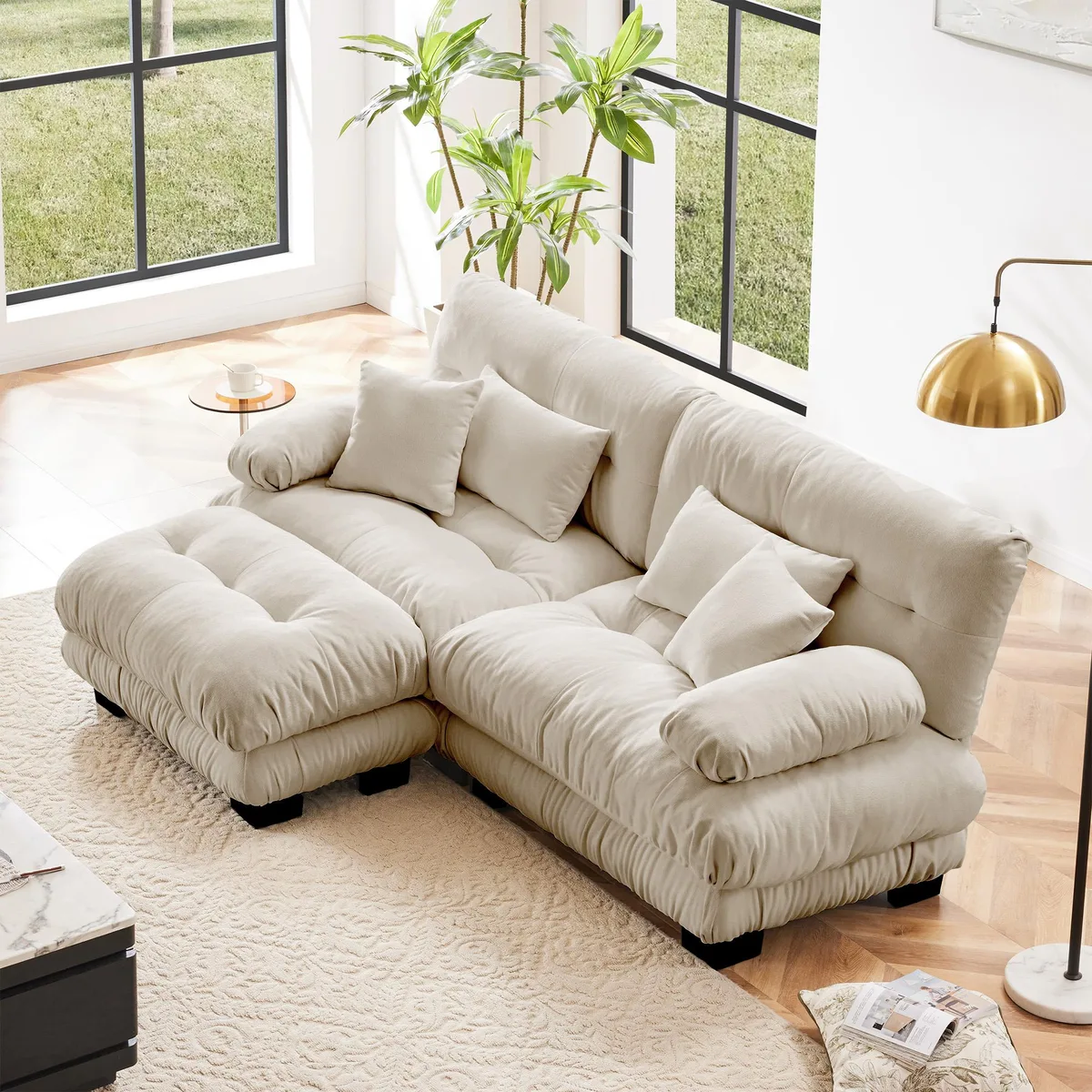 Light coffee chenille two-seater sectional with wide bolster arms, convertible ottoman, and four pillows