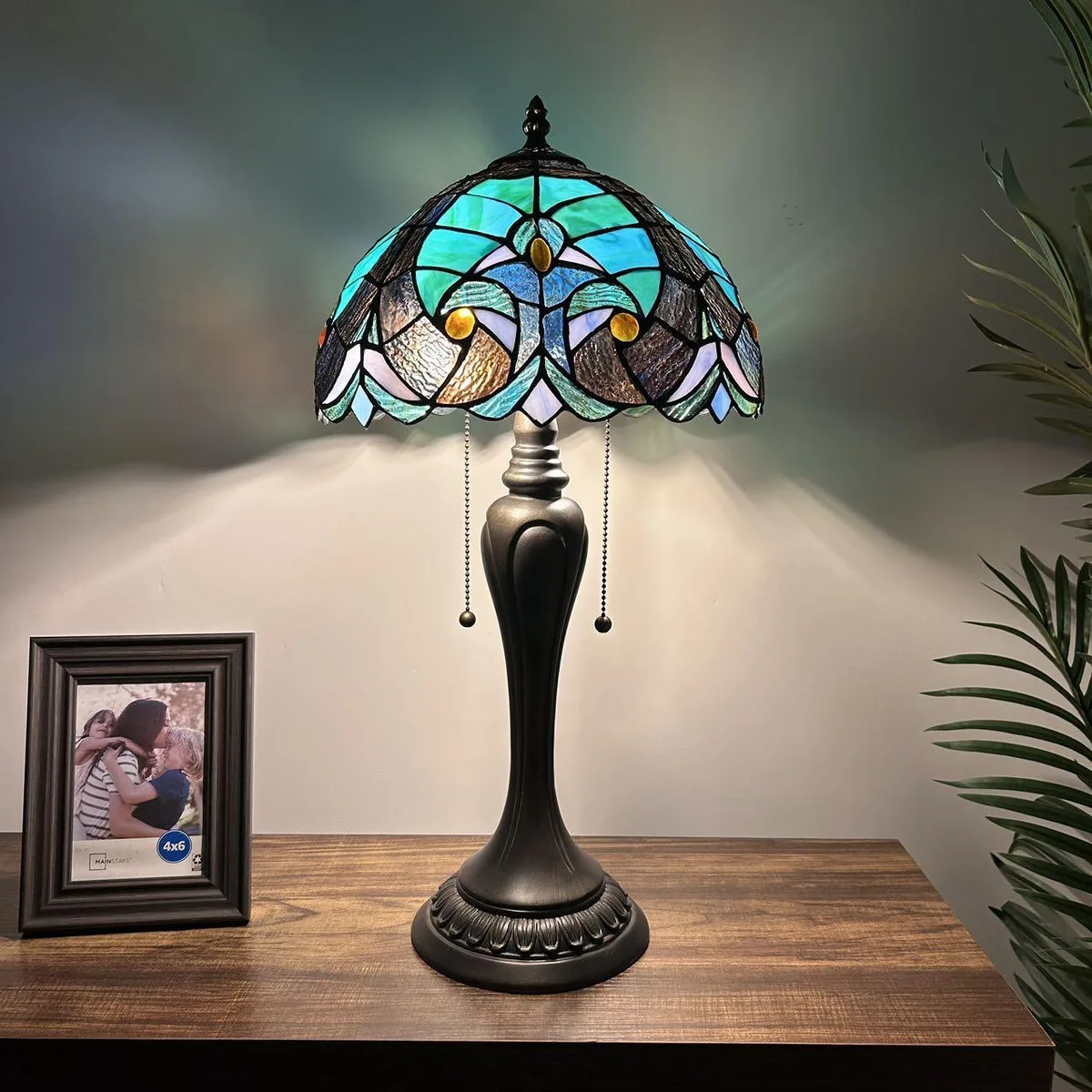 Tiffany table lamp with green brown stained glass shade and bronze resin base, 12 inch wide 22 inch high