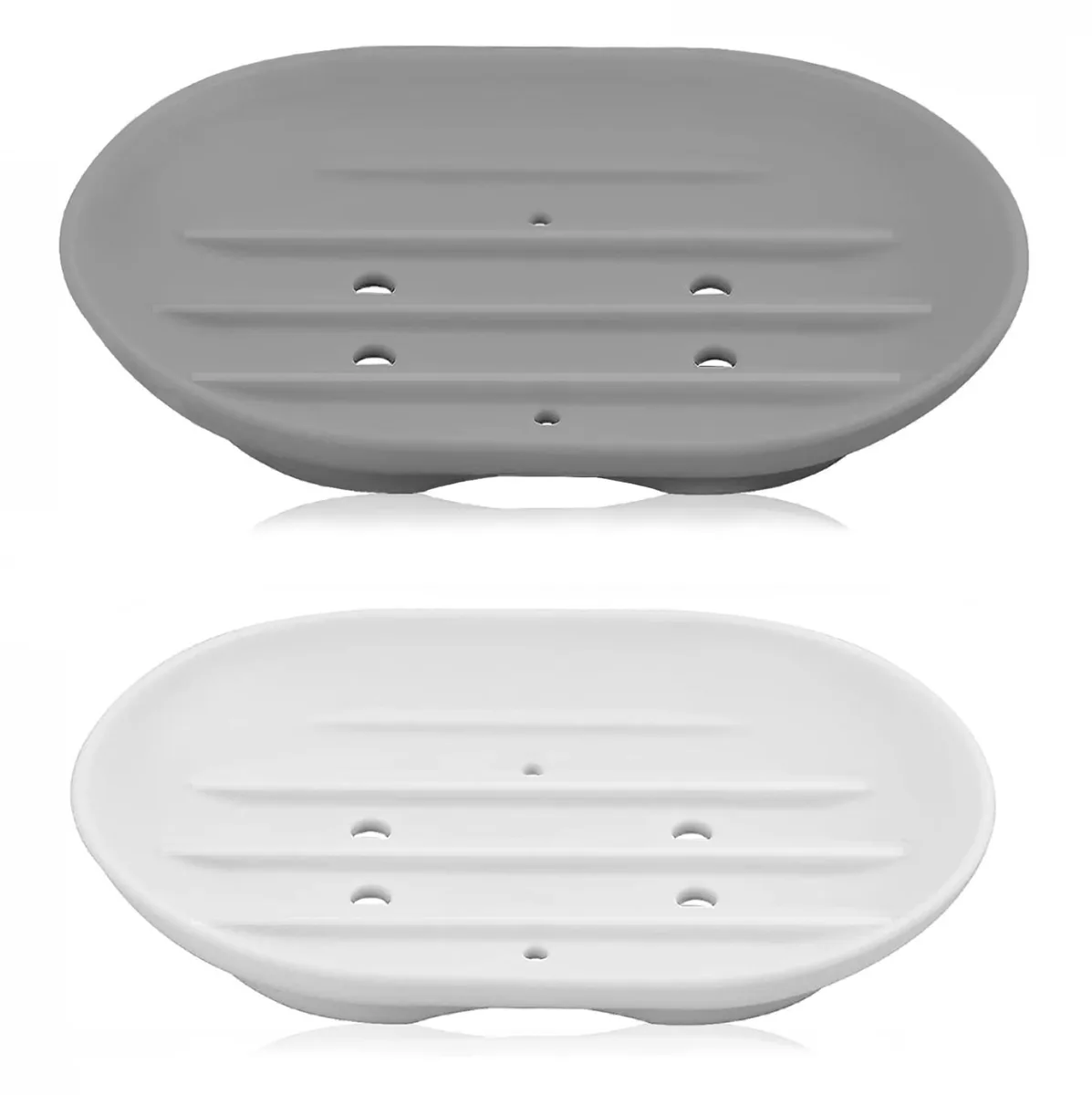Two silicone soap dishes, white and grey, with drainage holes and textured bases