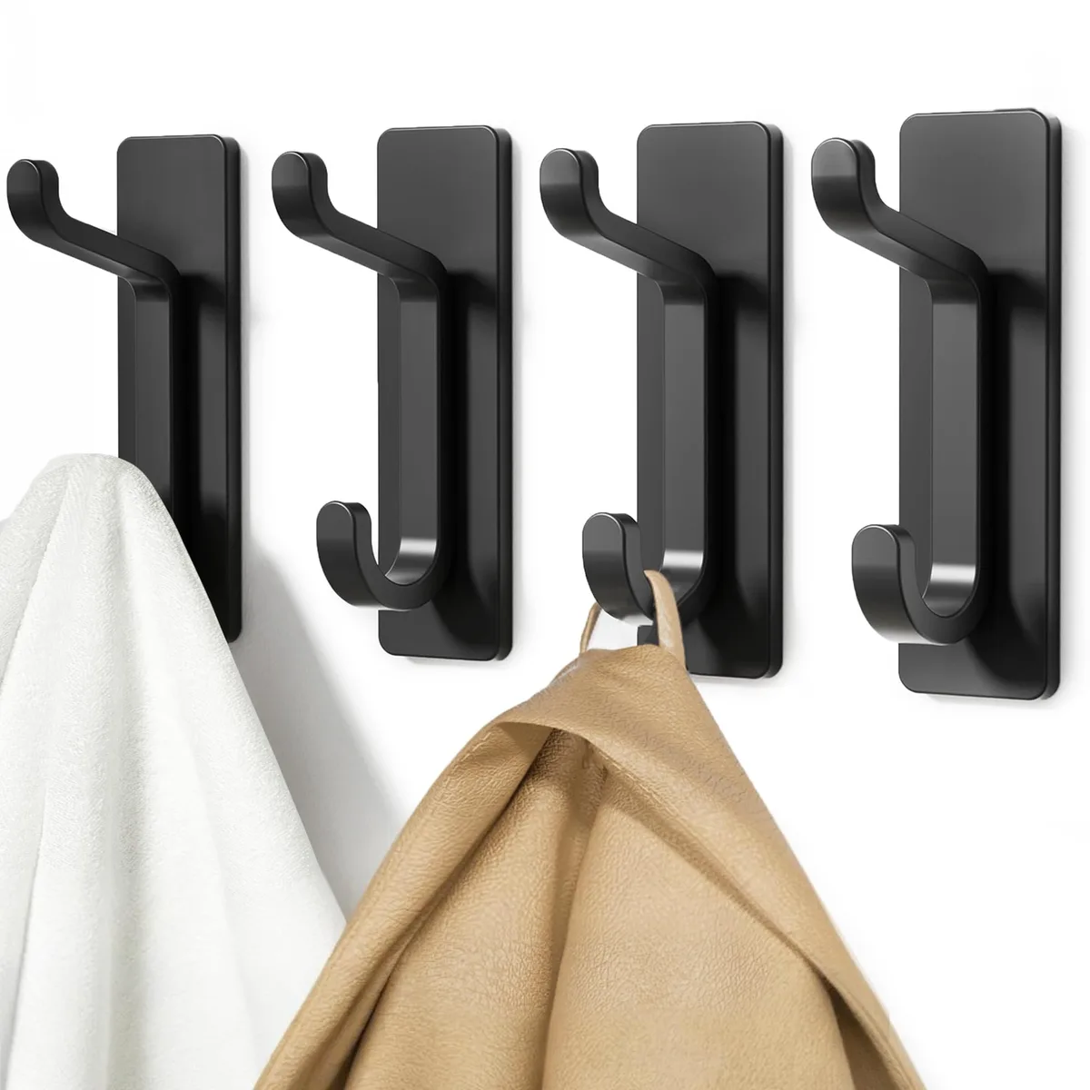 Four black adhesive double hooks on a white background