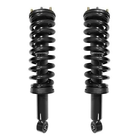 Pair of silver front strut assemblies with coiled springs and top mounts