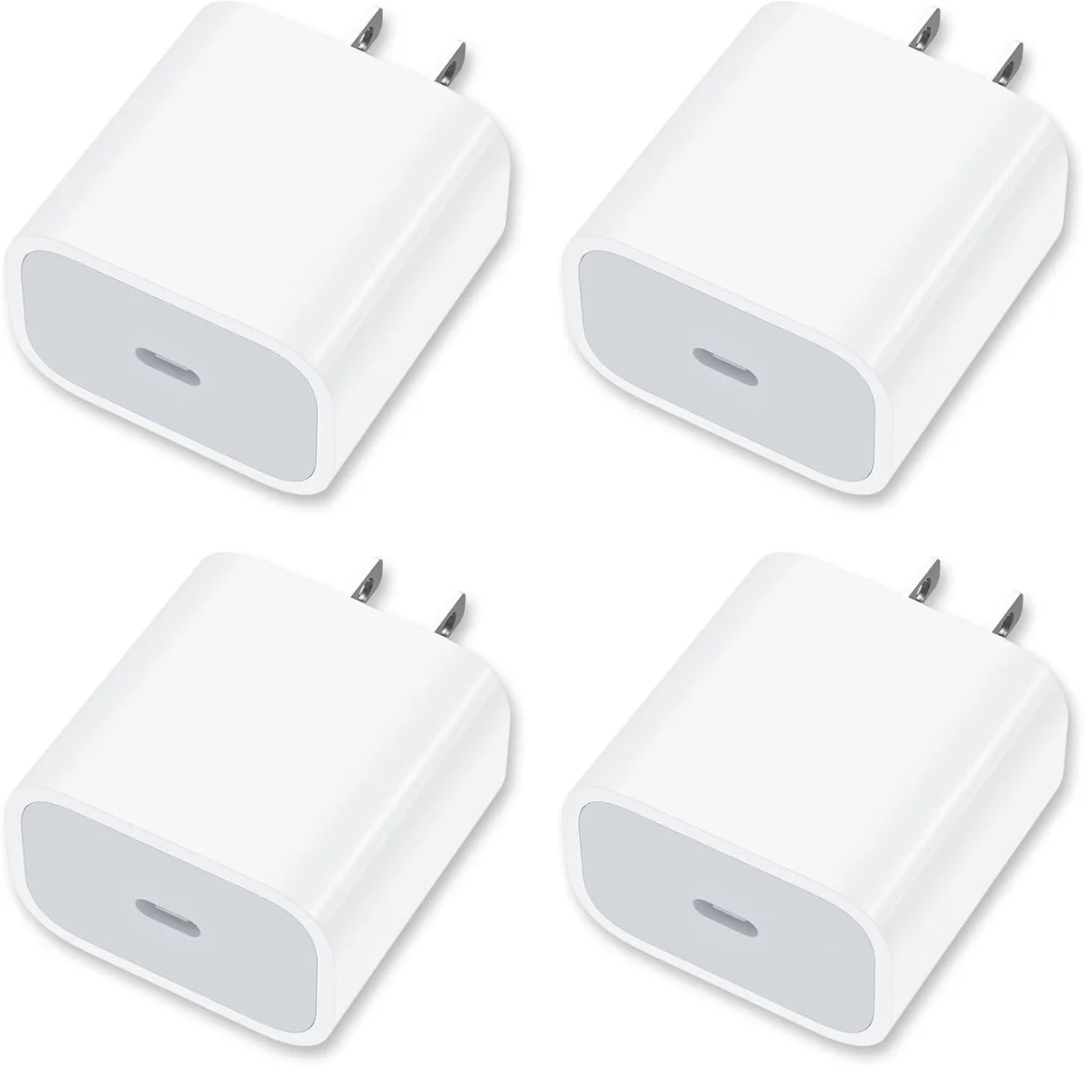 Four compact white USB-C wall chargers with foldable prongs