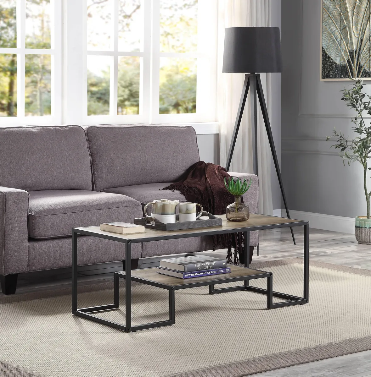 Rectangular coffee table with rustic oak top, black metal frame and lower shelf