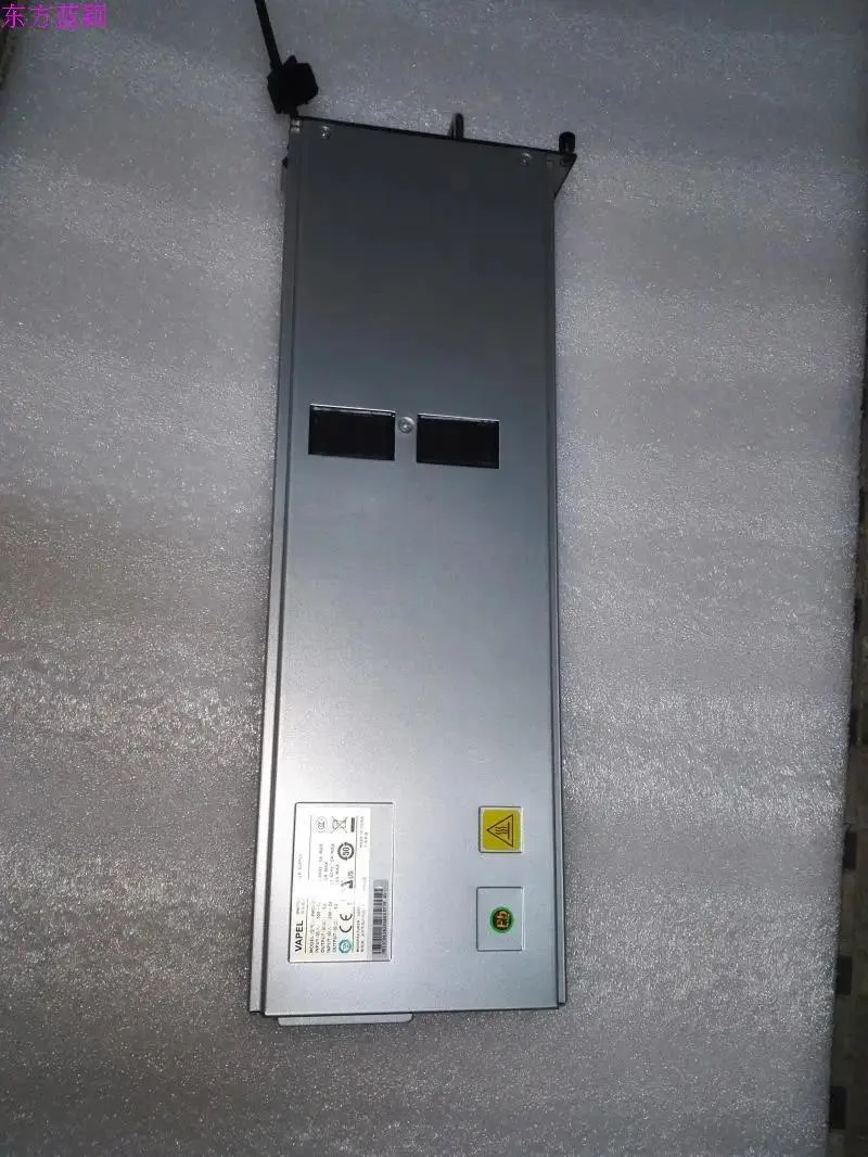Rectangular silver server power supply module with label showing PMCU800-48A