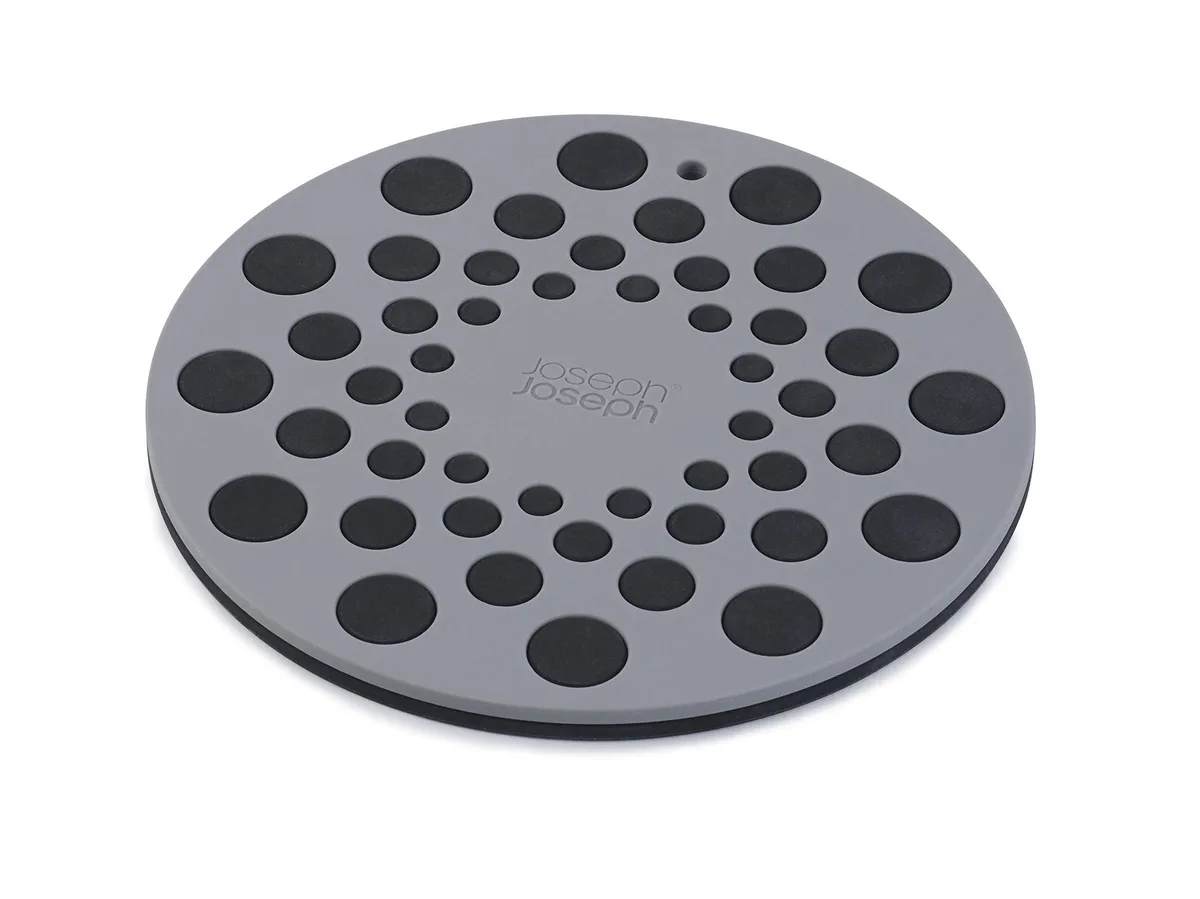 Two gray silicone trivets, flexible heat-resistant discs