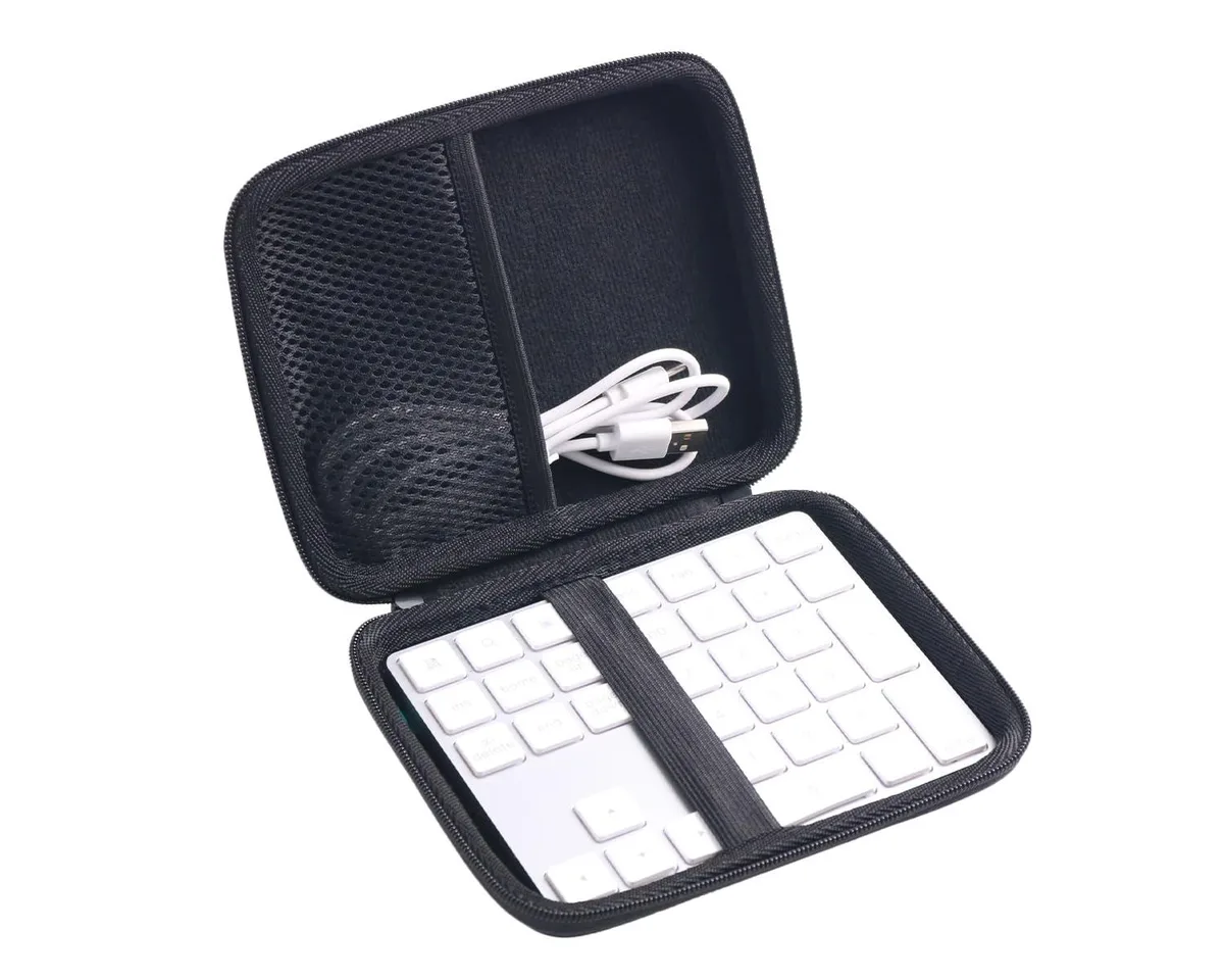Black hard-shell EVA travel case with 360-degree zipper and hand strap, shown empty