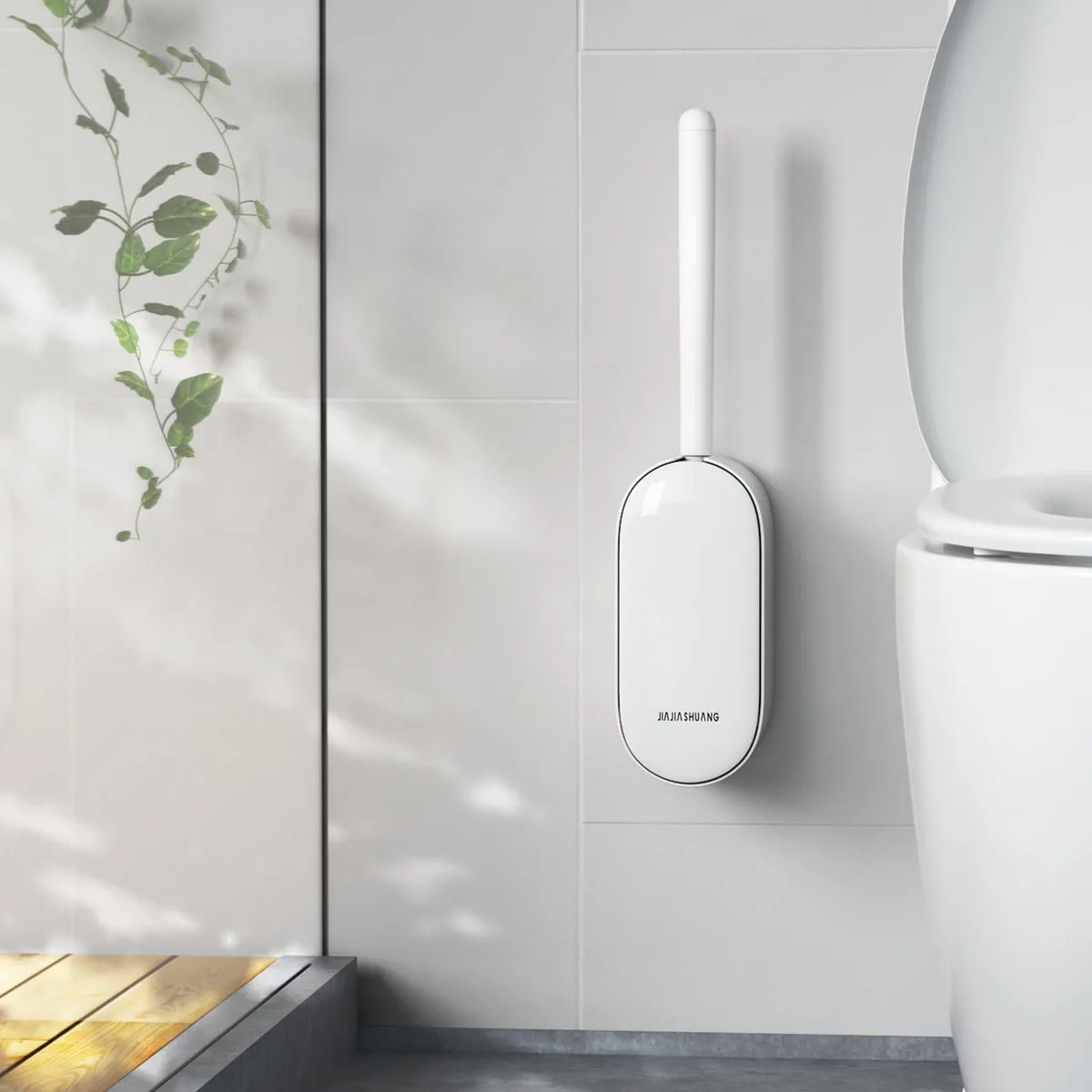 White plastic toilet brush in matching holder, 15 inches tall, wall-mount design with automatic lid