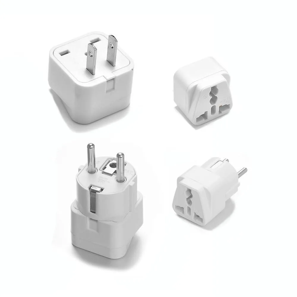 Two white travel adapters, one flat-pin one round-pin, compact credit-card size
