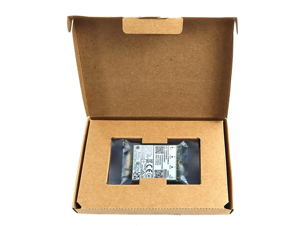 Green rectangular M.2 3052 WWAN card with gold contacts