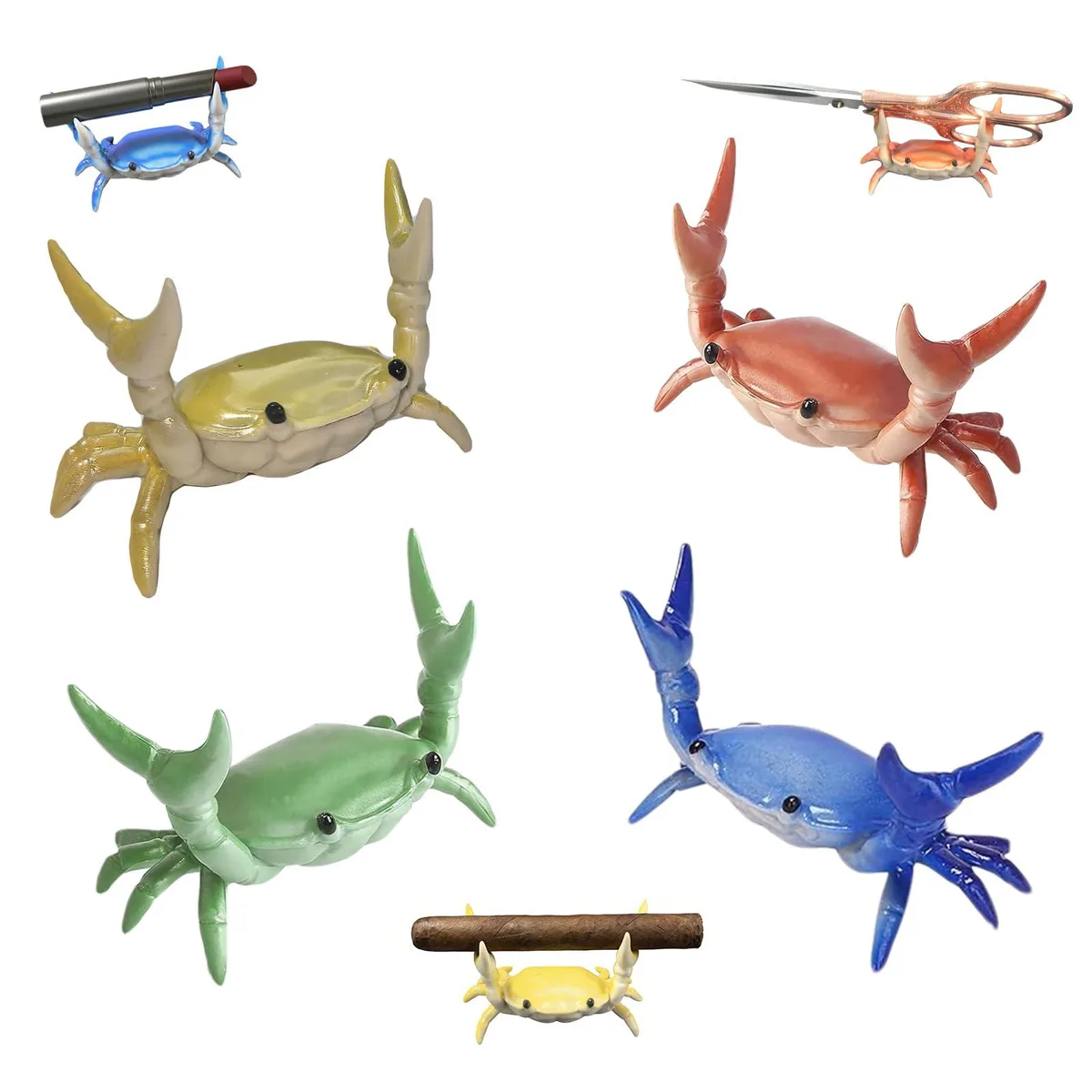 Four small silver crab-shaped desk organisers with claw slots for pens