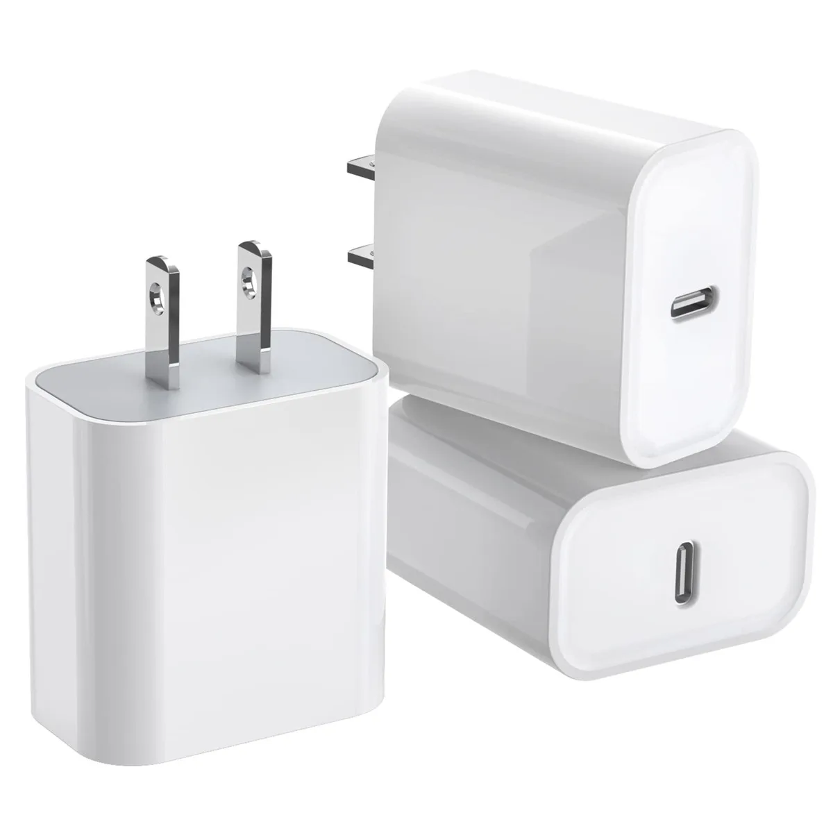 Three small white USB-C wall chargers side by side