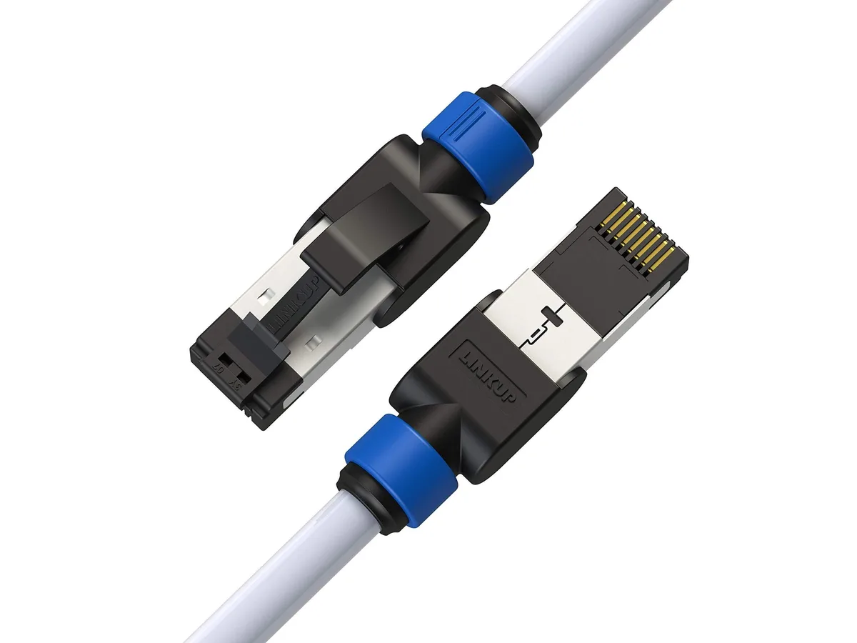 Three white Cat7 Ethernet cables with gold RJ45 connectors