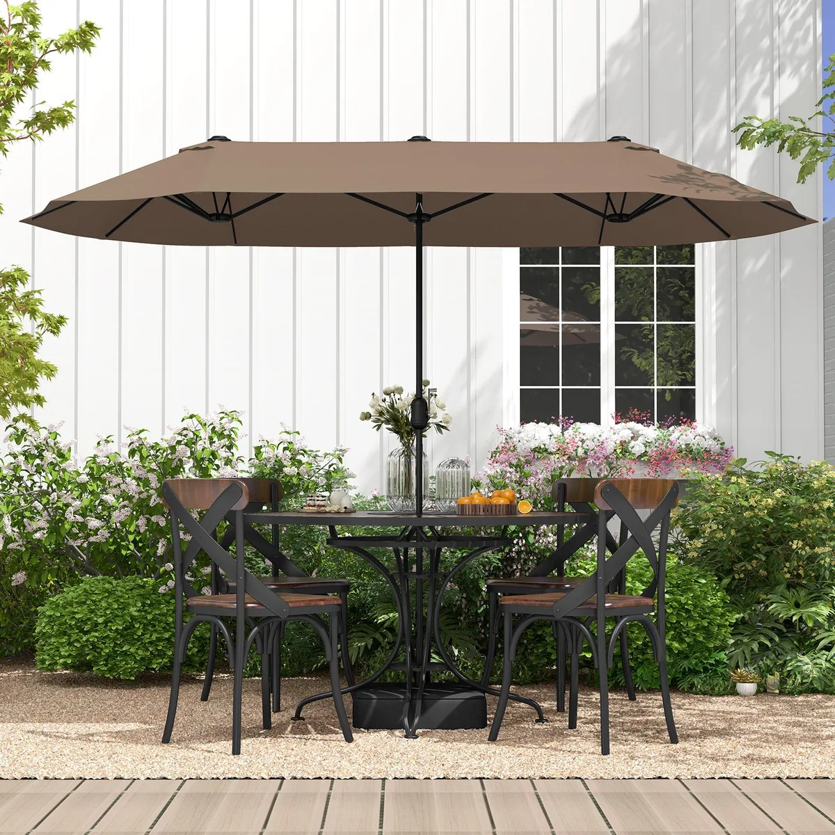 Tan double-sided patio umbrella with crank handle and metal ribs, 13 ft wide, cross base included