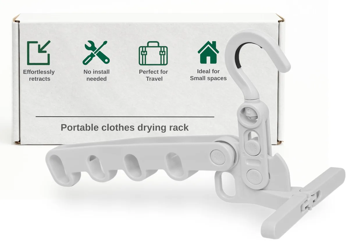 White folding metal clothes drying rack with over-door hook, shown open with five horizontal bars