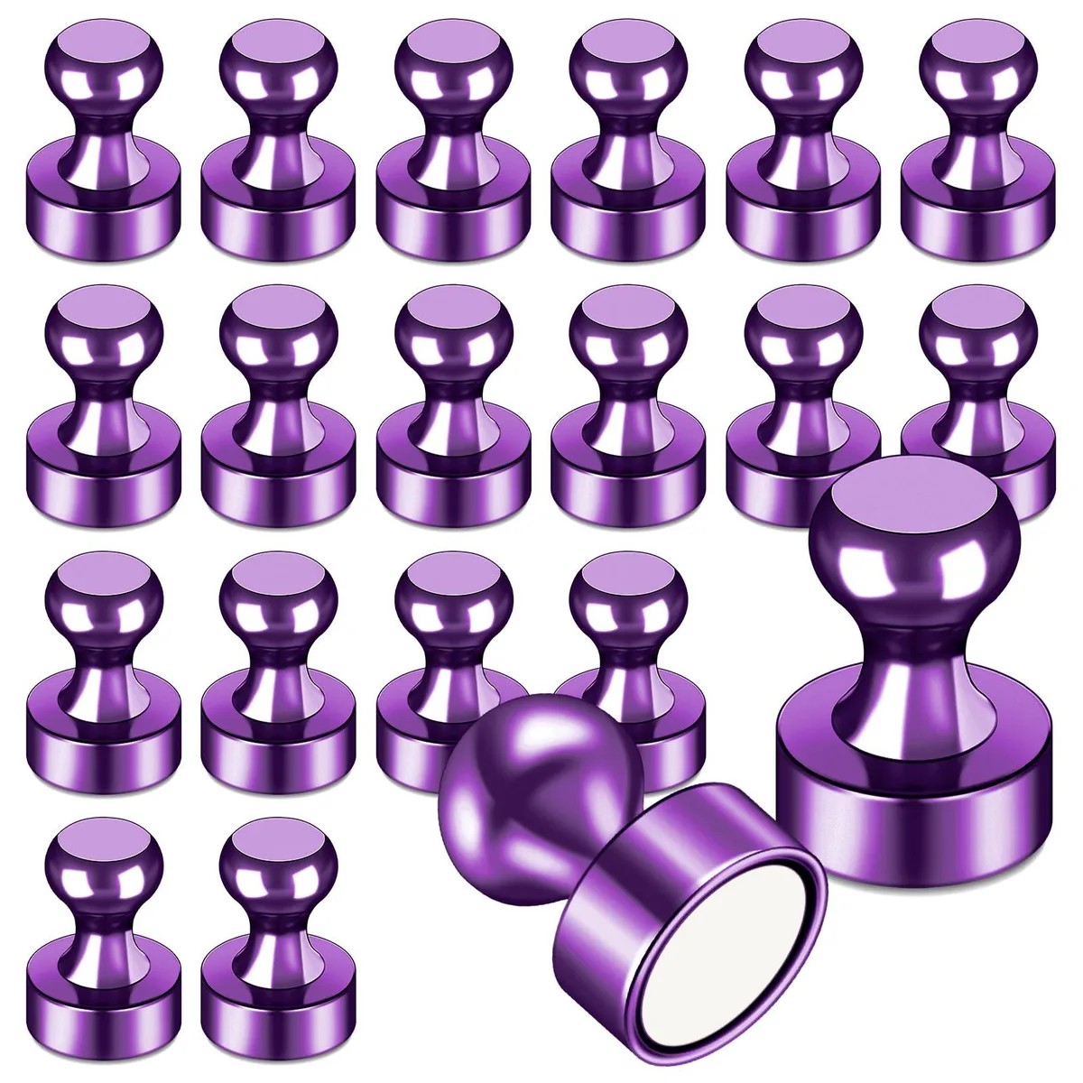 Twenty small purple magnets on a plain surface