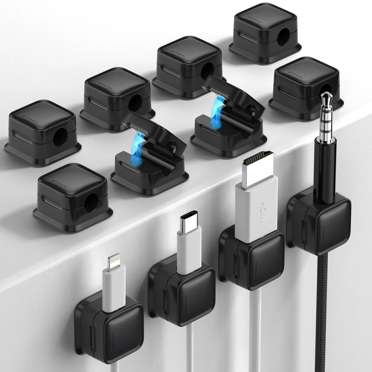 Twelve small square black plastic cable clips with adhesive backs, each about .78 by .78 by .1 inches