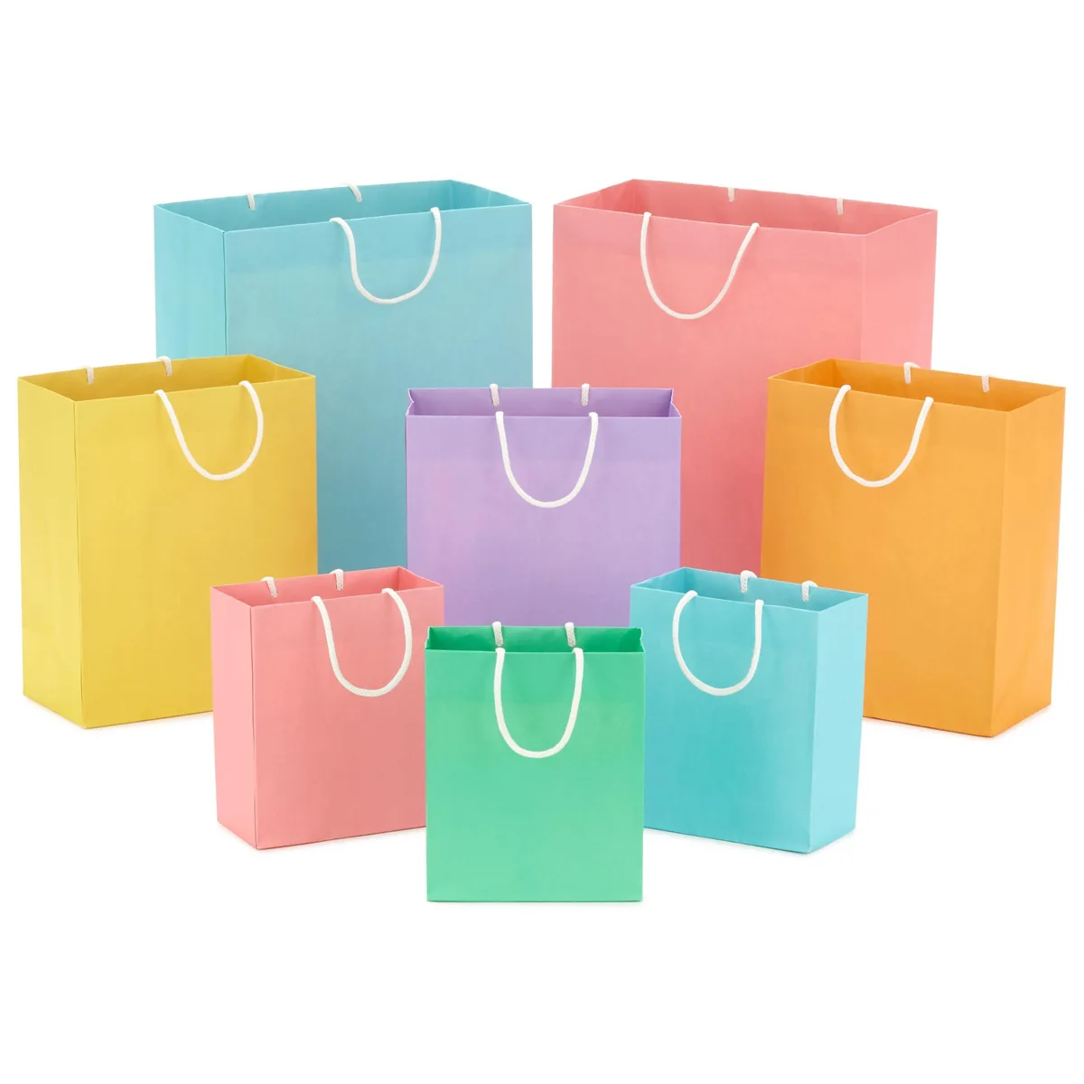 Eight pastel paper gift bags in three sizes with herringbone ribbon handles