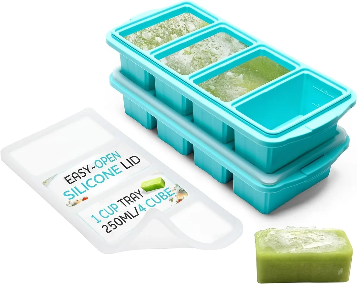 Two blue silicone freezer trays with clear lids and steel-rimmed tops