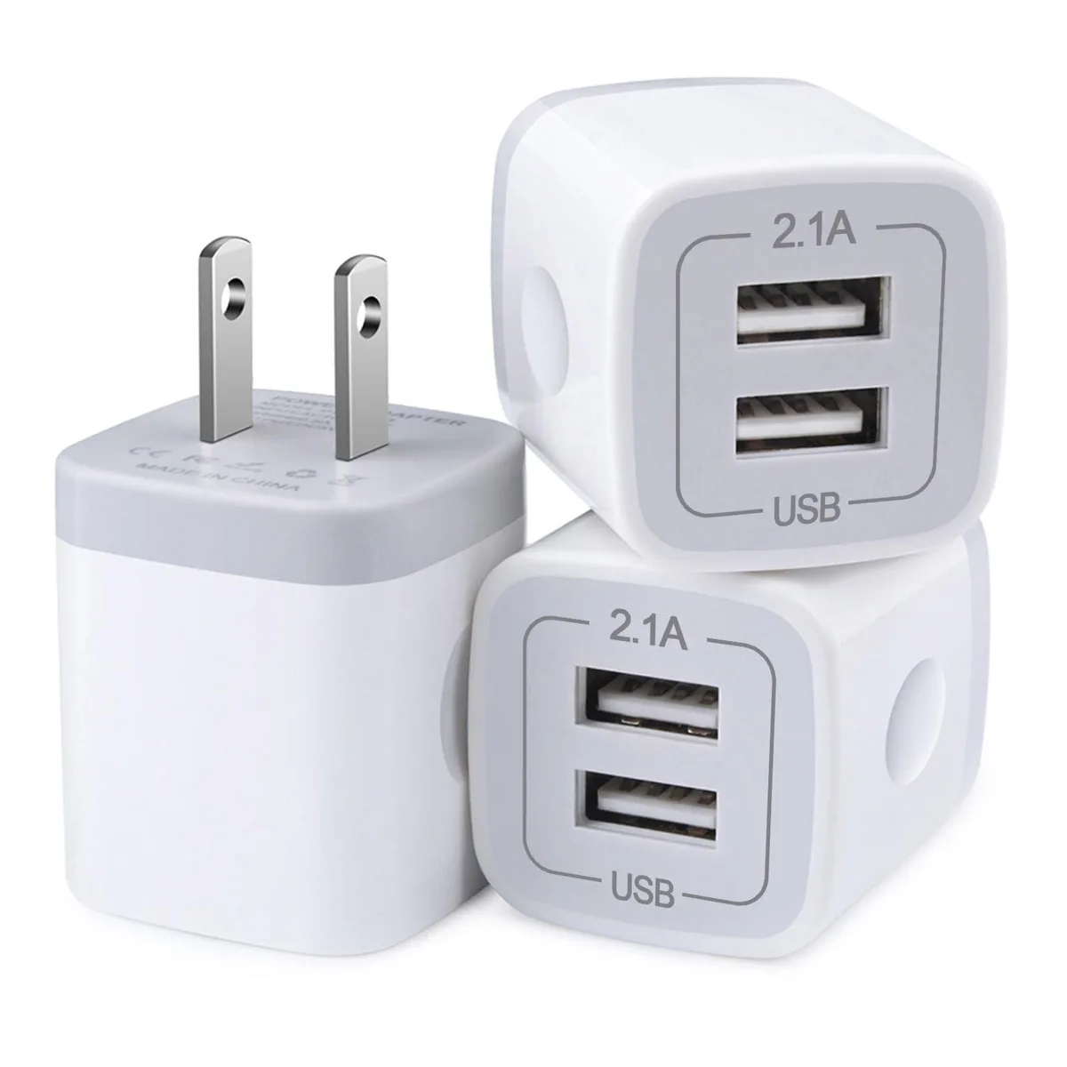 Three white cube USB chargers with dual ports