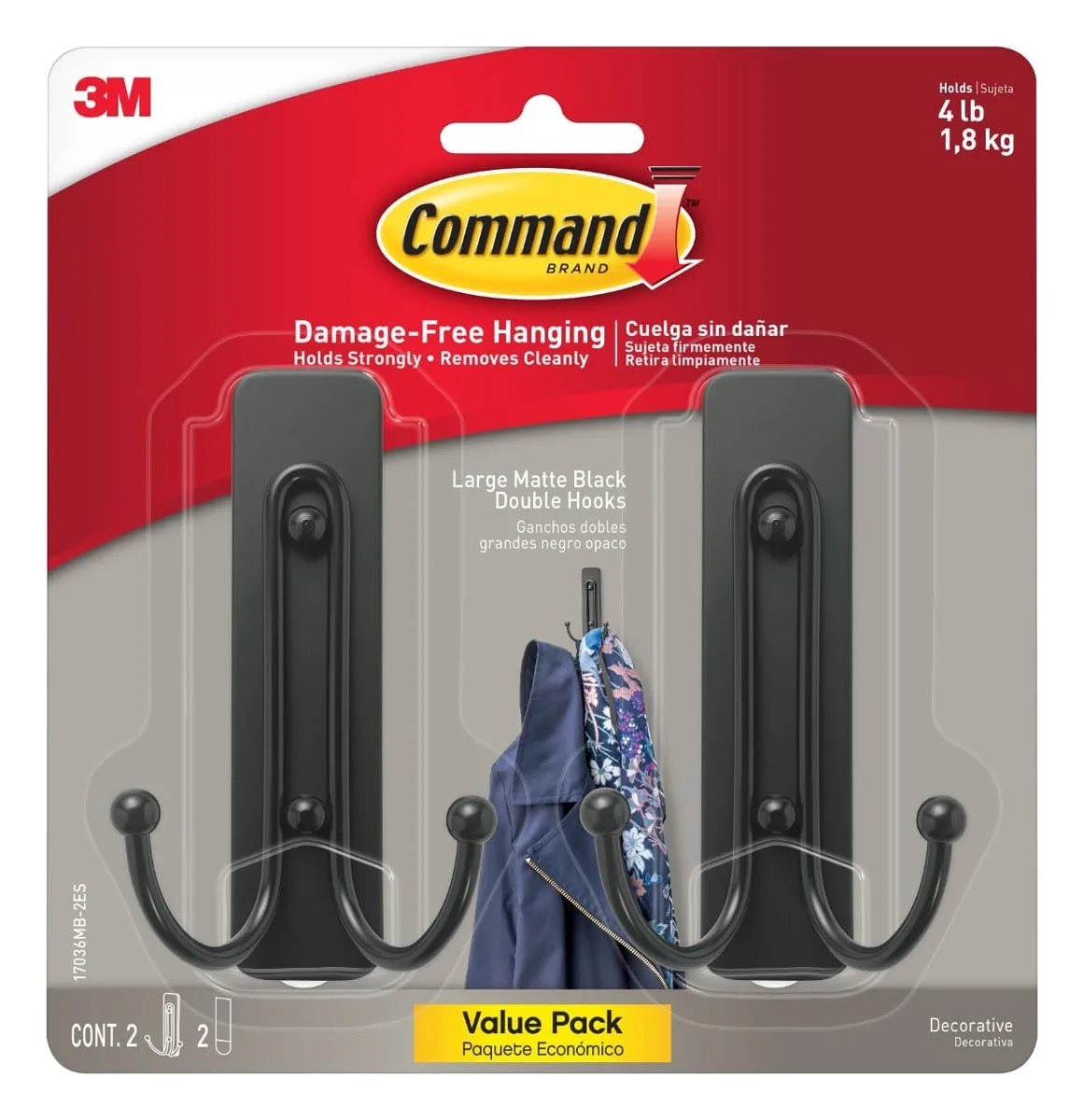 Two matte black double hooks with adhesive strips on white background