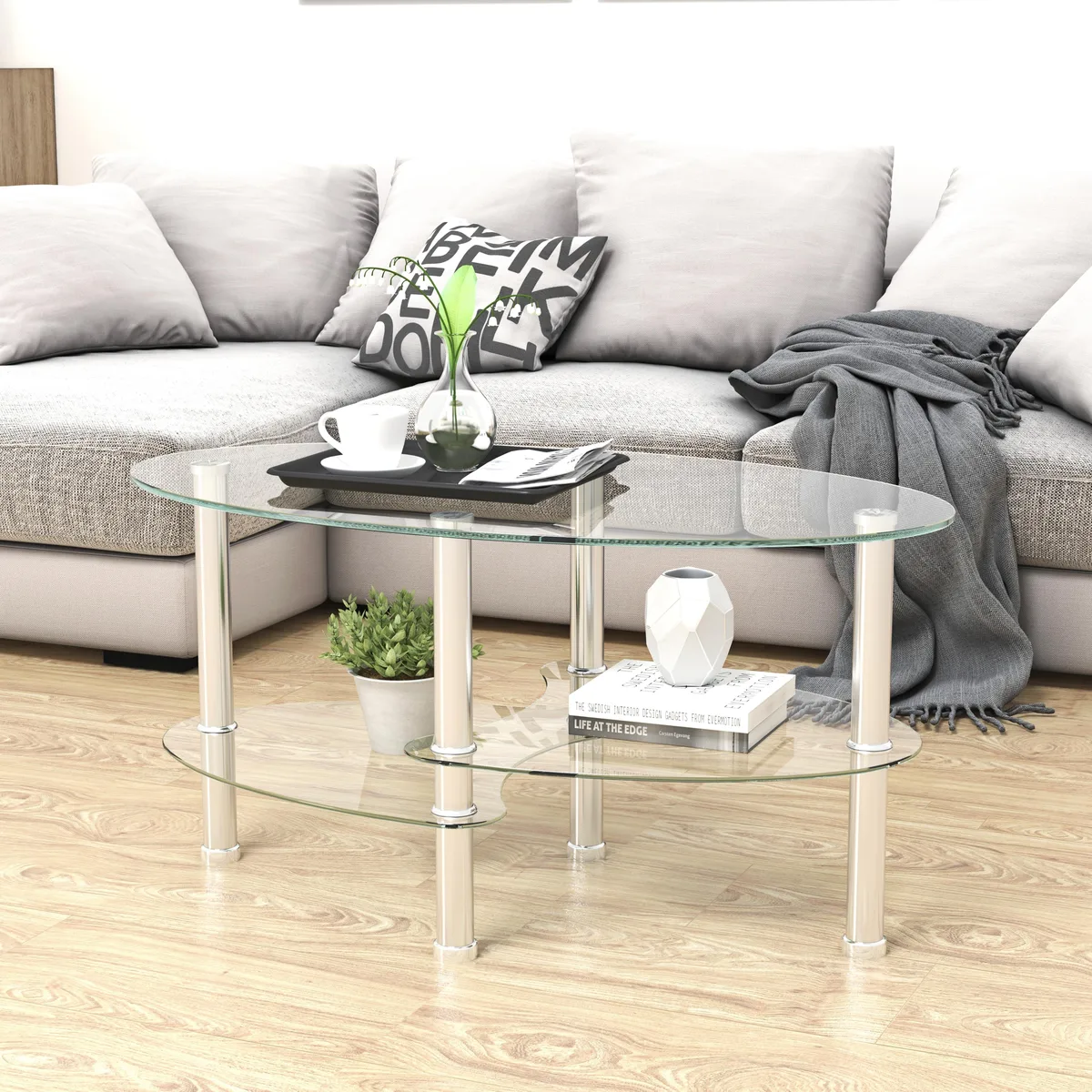 Three-tier oval glass table with stainless steel legs