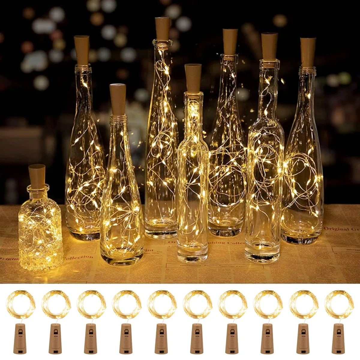 Ten copper-wire LED strands with cork stoppers, warm white glow