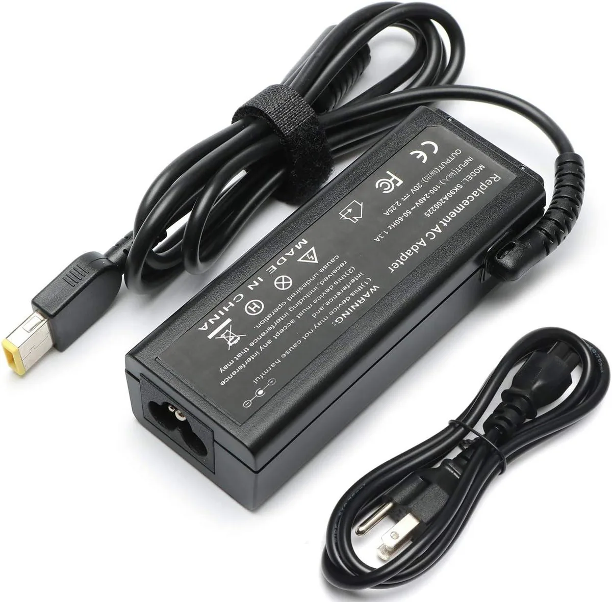Compact black rectangular AC adapter with yellow square USB tip and detachable power cord
