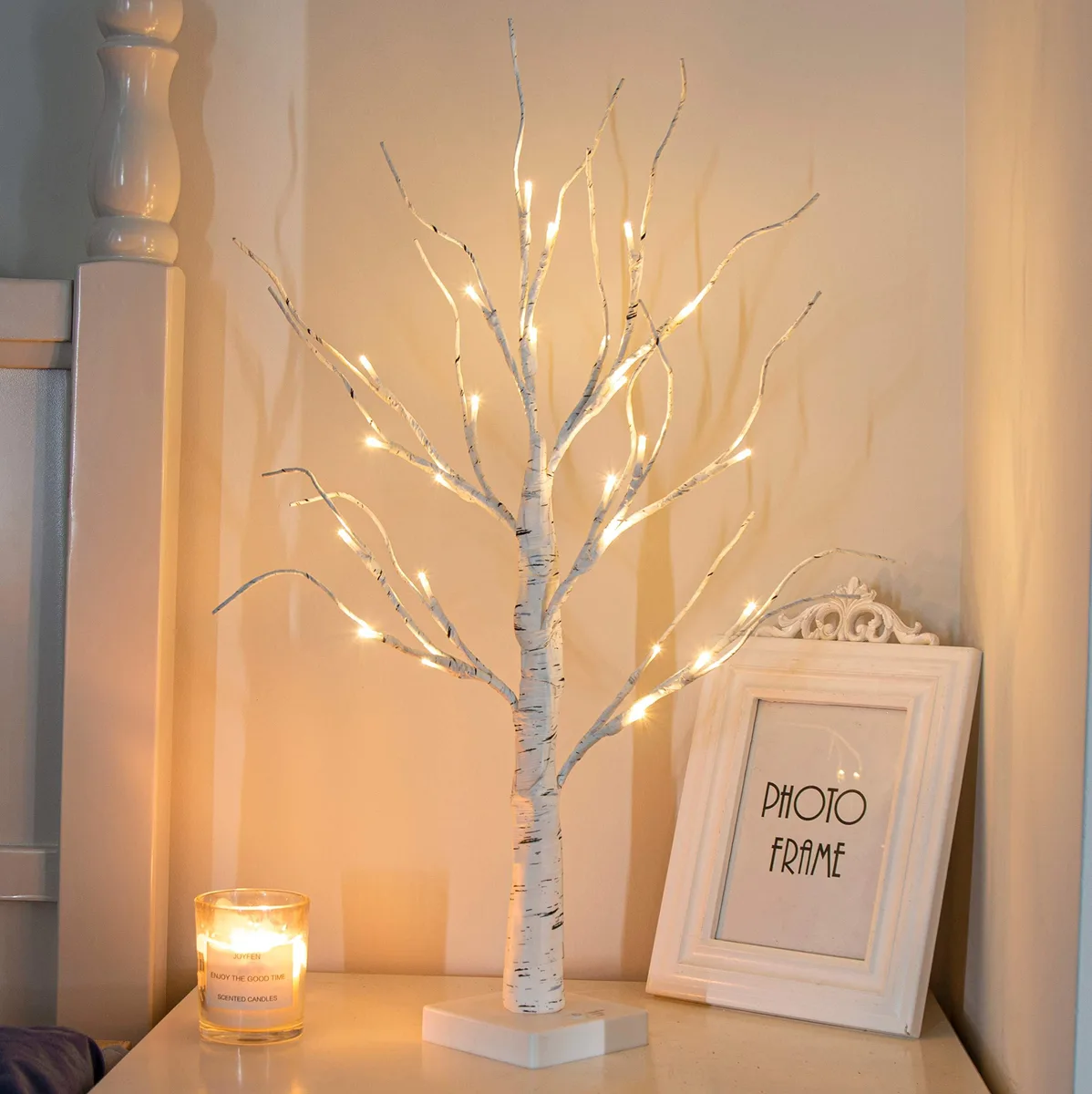 2 ft birch tree with 24 warm white LEDs on flexible branches square base timer button battery powered