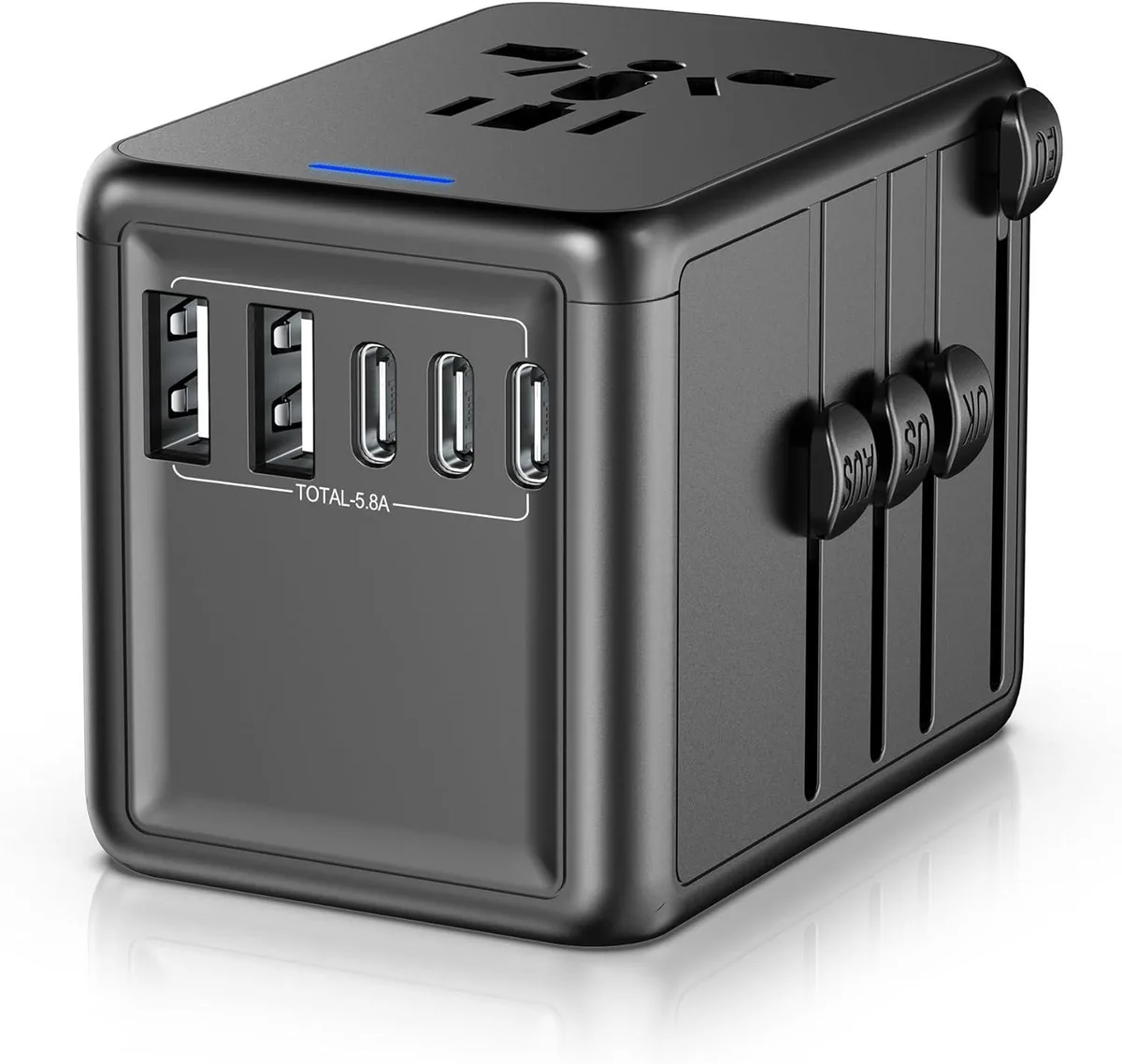 Compact white travel adapter with sliding plug selectors and multiple USB ports