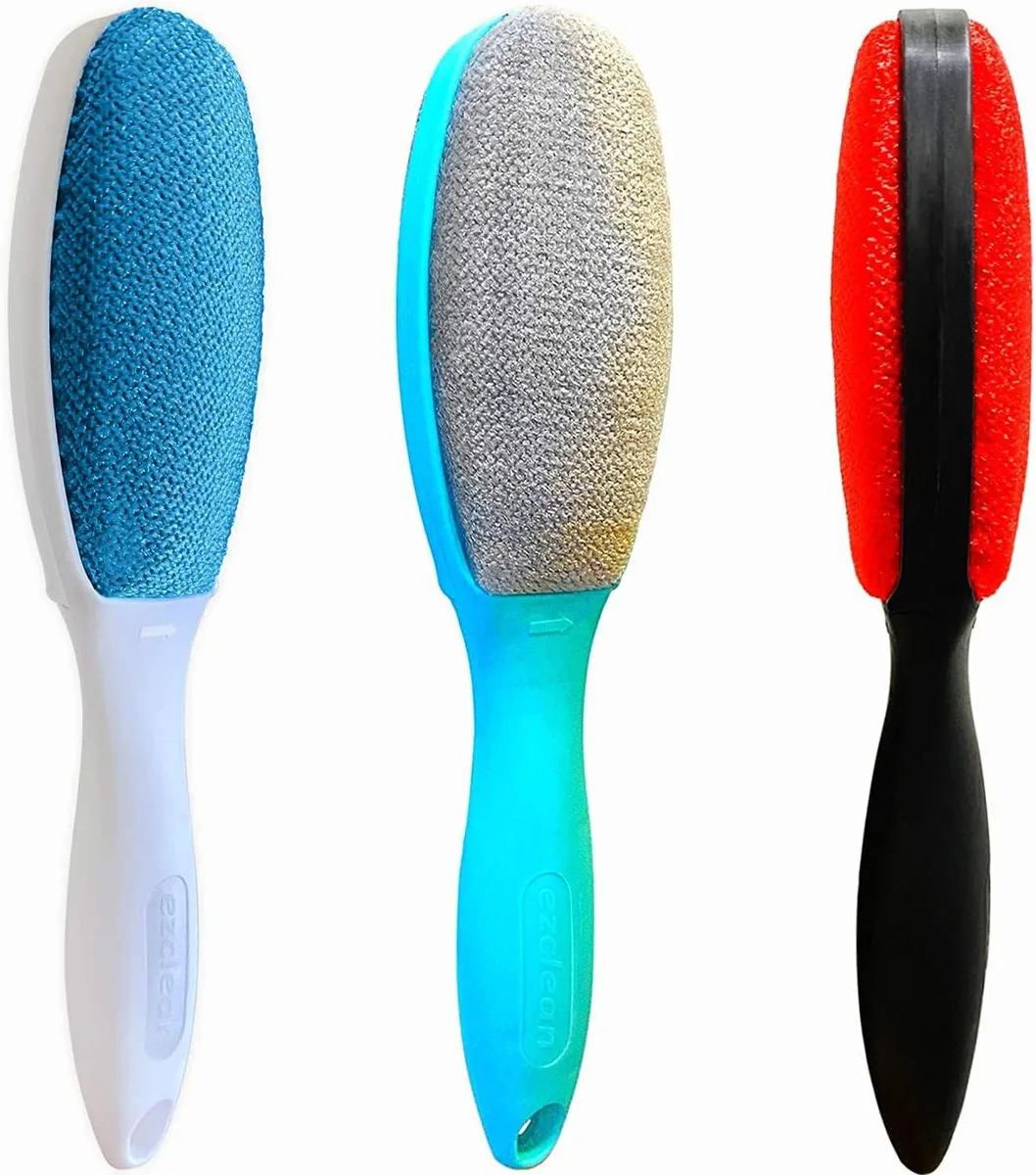 Three double-sided velvet lint brushes in assorted colours, compact rectangular handles with soft fluffy bristles