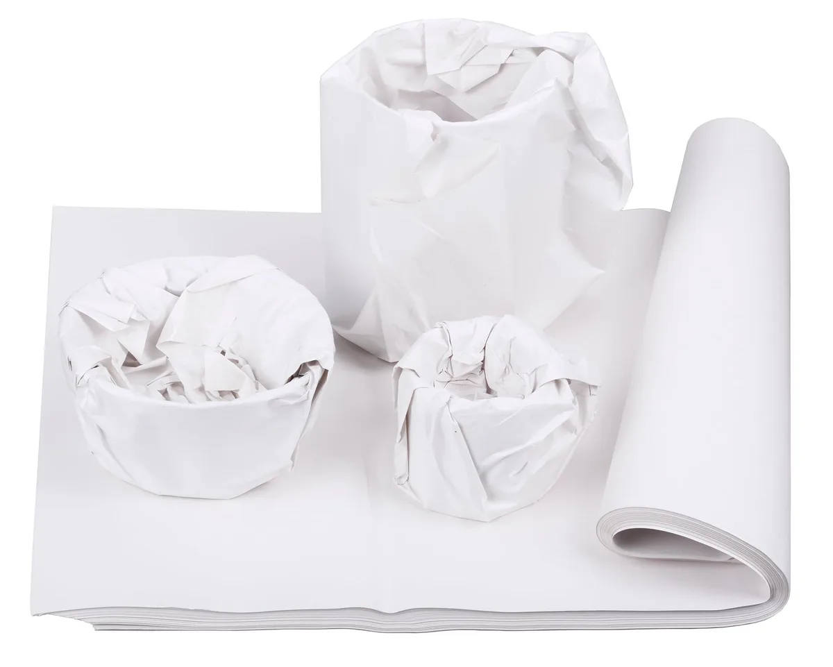 Stack of 130 uncoated newsprint sheets, 27 by 17 inches, light off-white finish