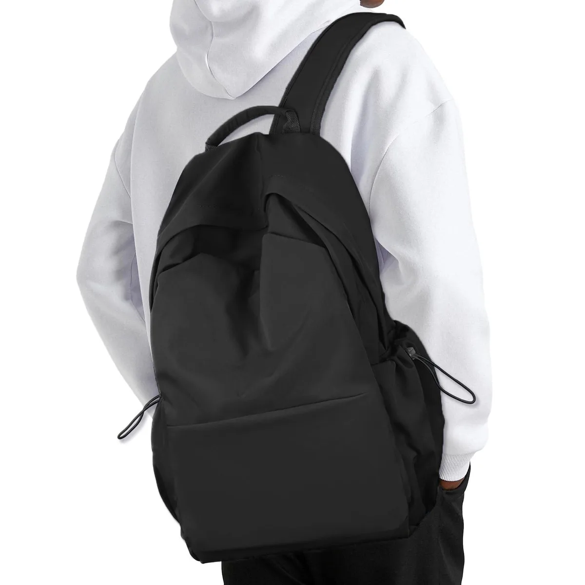 Black nylon laptop backpack with adjustable padded shoulder straps, multiple zippered compartments and side pockets