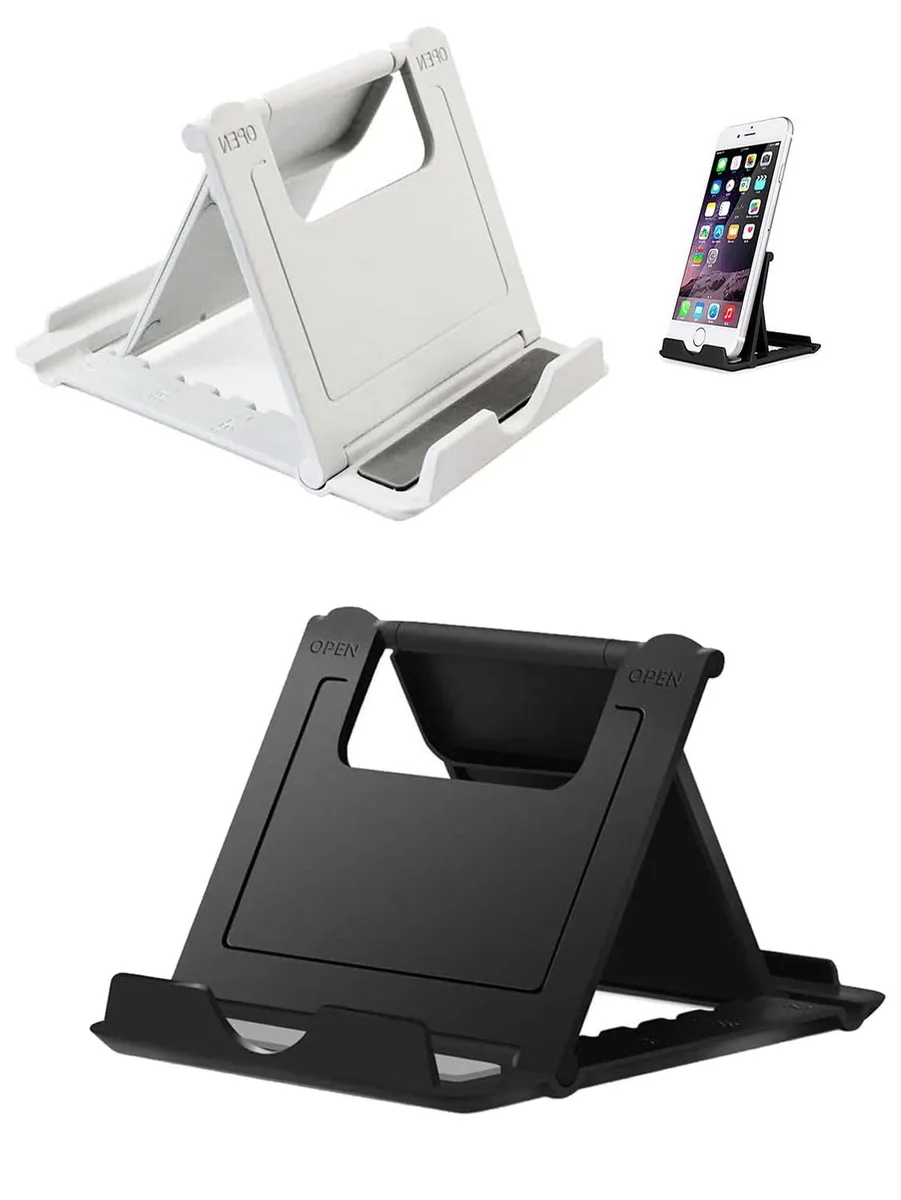 Two foldable phone stands, one black one white, lying flat on a surface