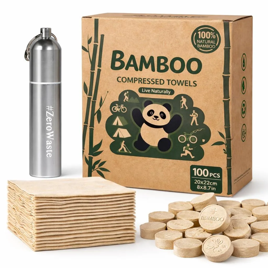 A small brown cardboard box containing 100 compressed bamboo towel tablets with a metal keychain case