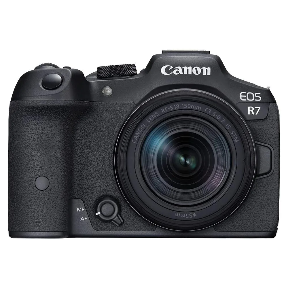 Black mirrorless camera body with silver 18-150mm zoom lens attached