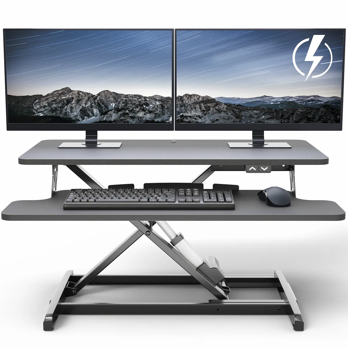 Black electric desk riser with dual tier surface and keyboard tray