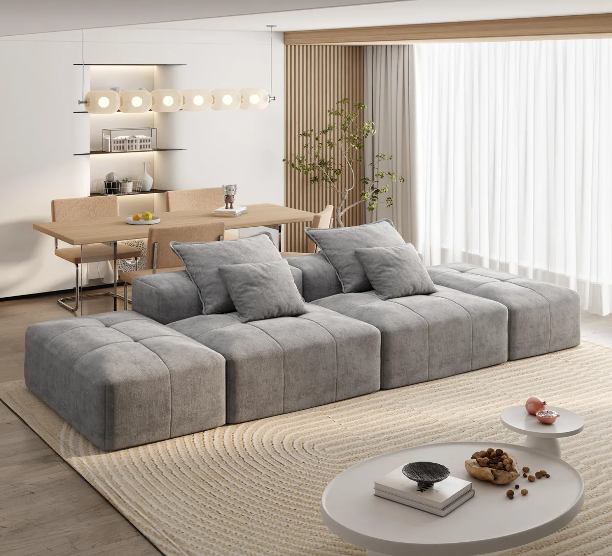 Grey modular sectional with two ottomans two seats and four pillows in chenille fabric