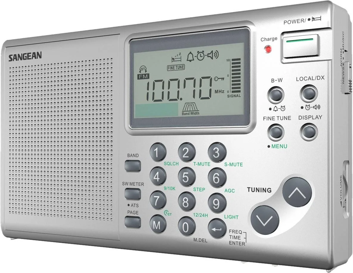 Silver world-band radio receiver with keypad and rotary tuning