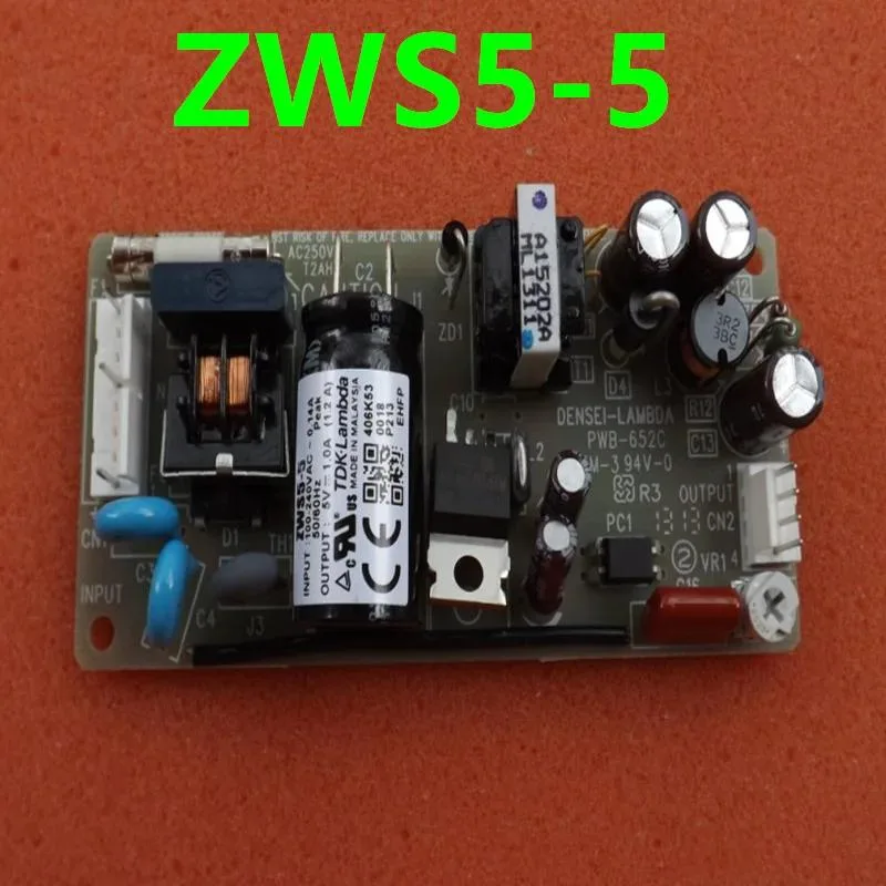 Rectangular ATX power supply unit with matte black metal casing and cooling fan grille