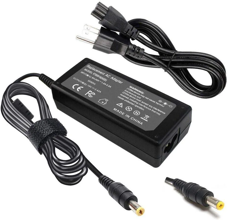 Black rectangular AC adapter with yellow-tip barrel connector and three-prong plug